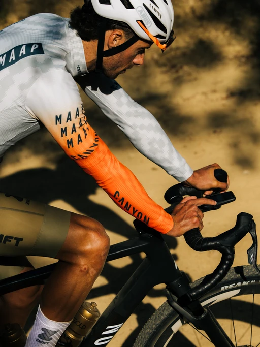 freddy ovett checking his coros dura during a climb