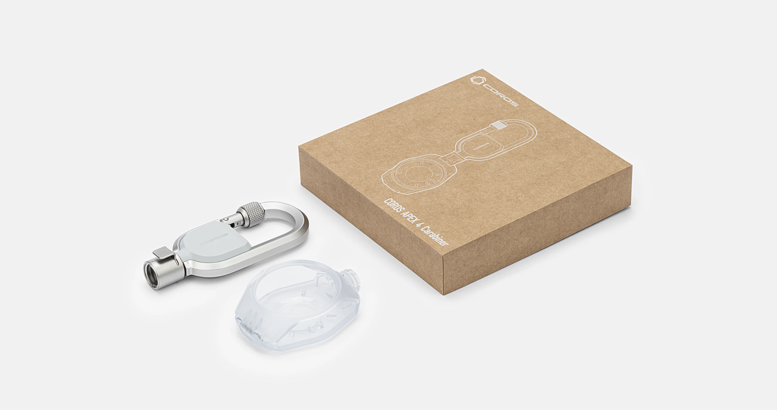 Contenu de la boîte qui emballe le mousqueton pour montre COROS : mousqueton en métal, boîtier de protection transparent pour APEX 4 et boîte du produit.
