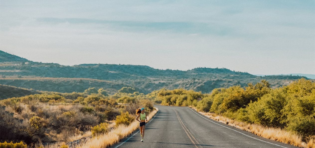 An image of molly seidel running on a local road. 