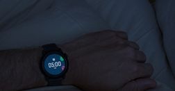 A close-up image of the alarm showing 5am on a black COROS PACE 3 watch. 