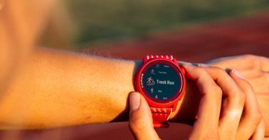 A close-up image of a runner selecting Track Run mode on a COROS PACE 3 Track Edition watch.