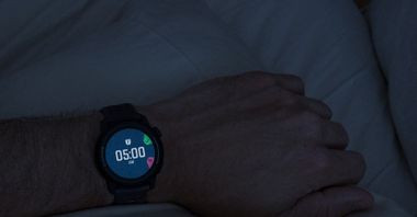 A close-up image of the alarm showing 5am on a black COROS PACE 3 watch.